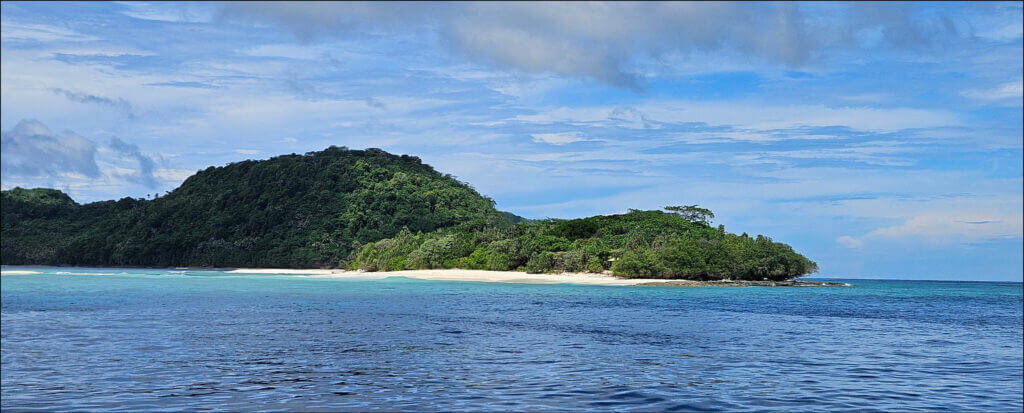 Small islands as seen from the boat while travelling through the banda islands in the Maluku region in Indonesia