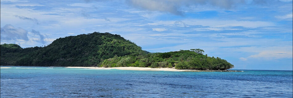 Small islands as seen from the boat while travelling through the banda islands in the Maluku region in Indonesia