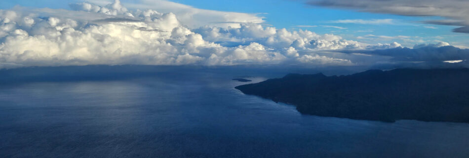 Ambon island appears out of nothing in the middle of the sea as seen from the plane