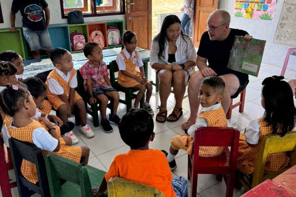 Jan Boelo reading stories to children at the school of Heka Leka on Saparua Island Indonesia