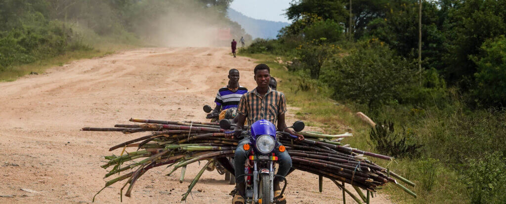 how to travel to karamoja uganda boda boda passing by