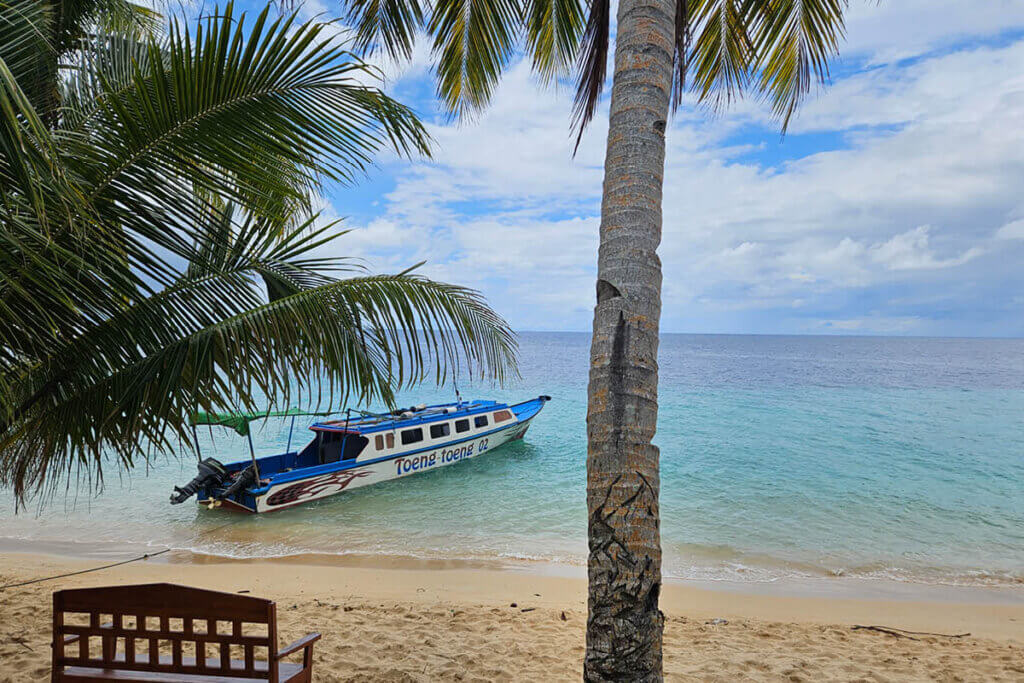 travel stories shaped by culture in the Banda Islands Moluccas Indonesia tropical beach and boat