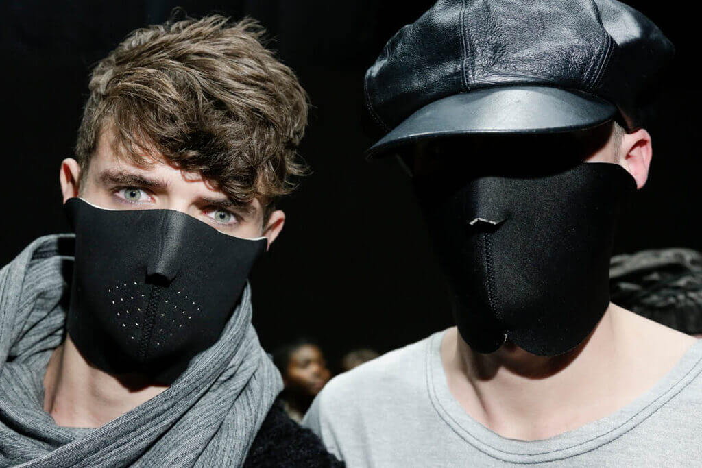 JANBOELO fall winter 2014 collection show two models wearing black face masks.