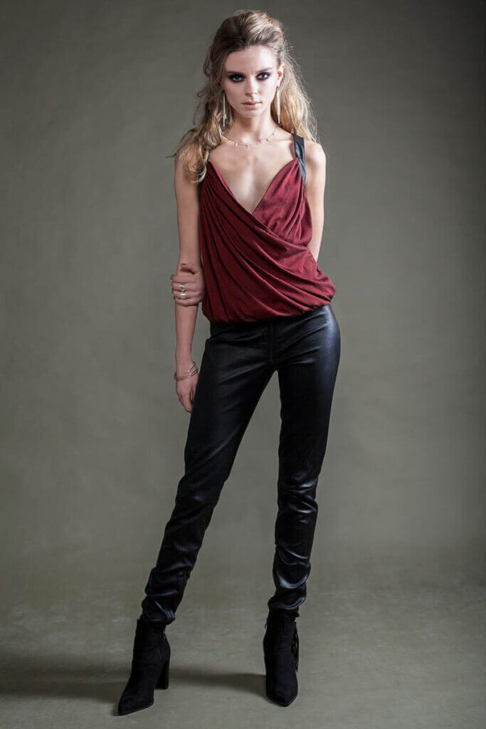 JANBOELO Model in stylish burgundy top and trousers.