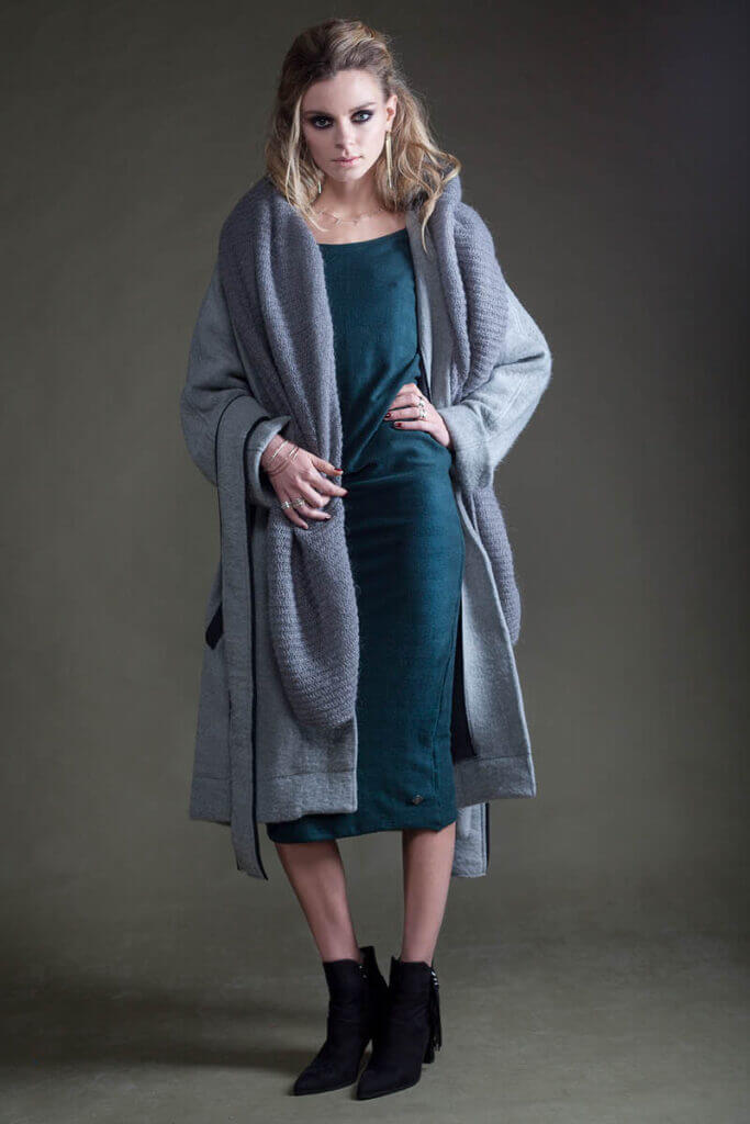 JANBOELO Model in elegant layered grey outfit with green dress.