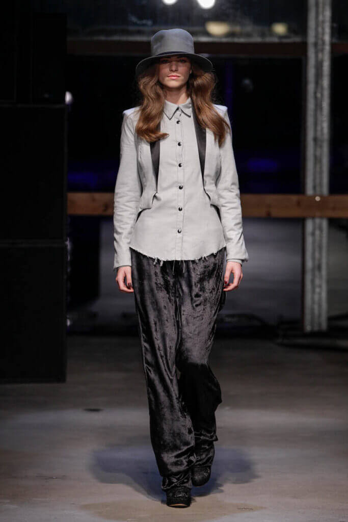 JANBOELO show Fall Winter 2013 2014 collection Model in grey shirt and trousers.