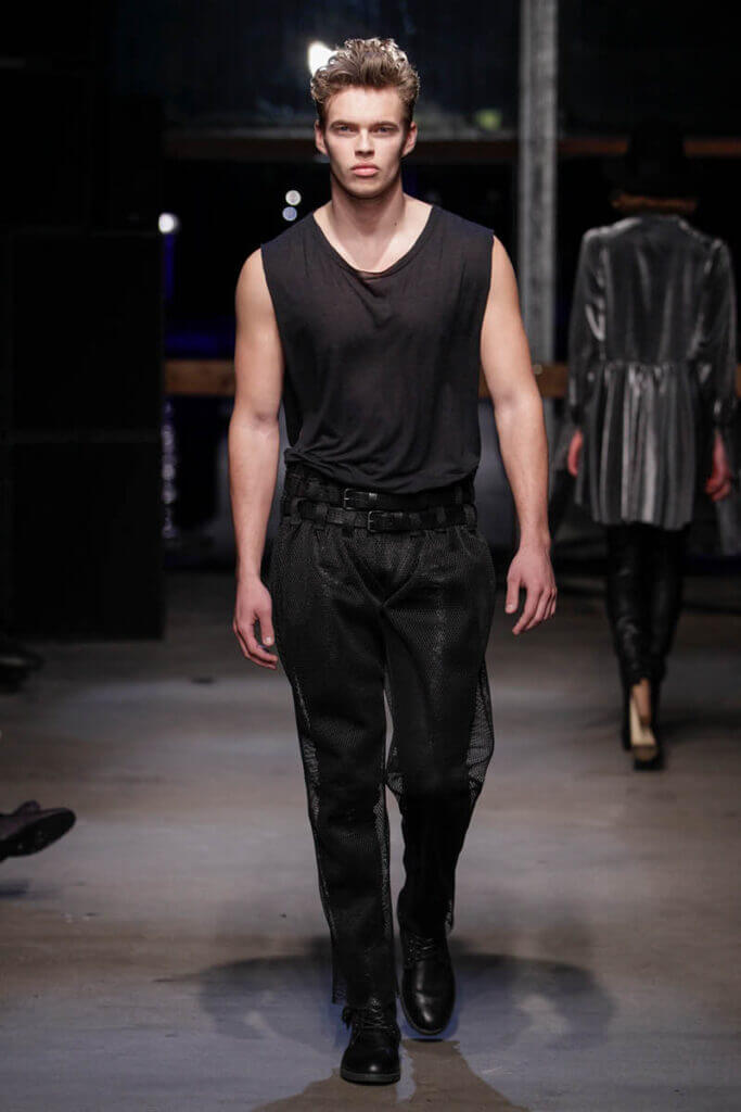 JANBOELO show Fall Winter 2013 2014 collection Model in black outfit walking runway.