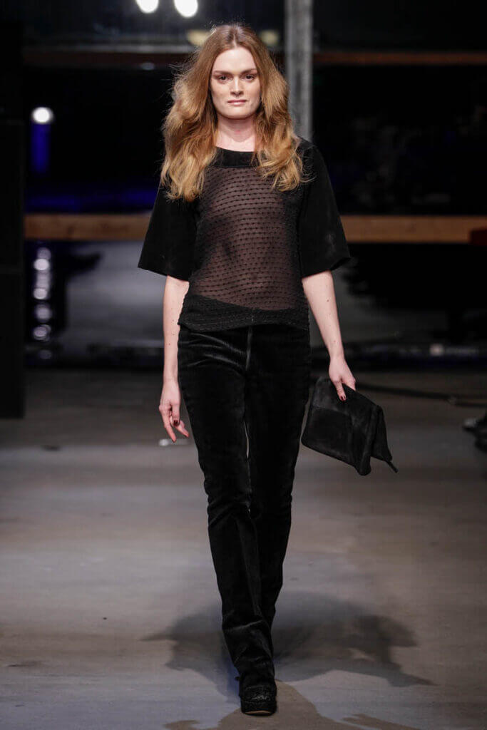 JANBOELO show Fall Winter 2013 2014 collection Model in sheer top and trousers.
