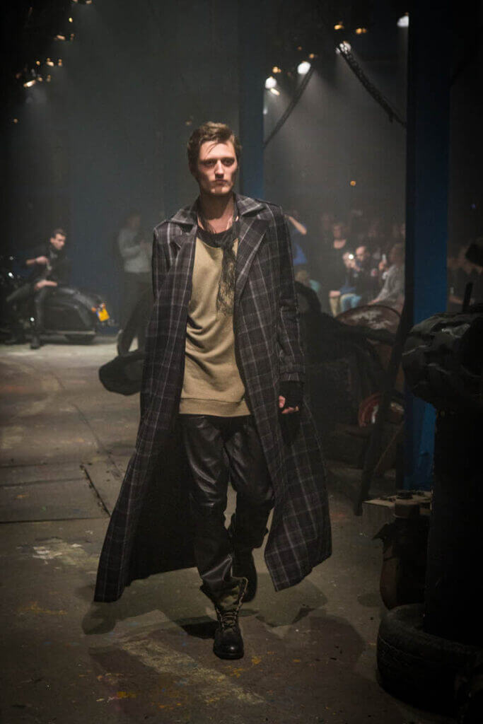 JANBOELO Fall Winter 2015 collection presentation at Paradigm Groningen, Model in large coat with leather trousers