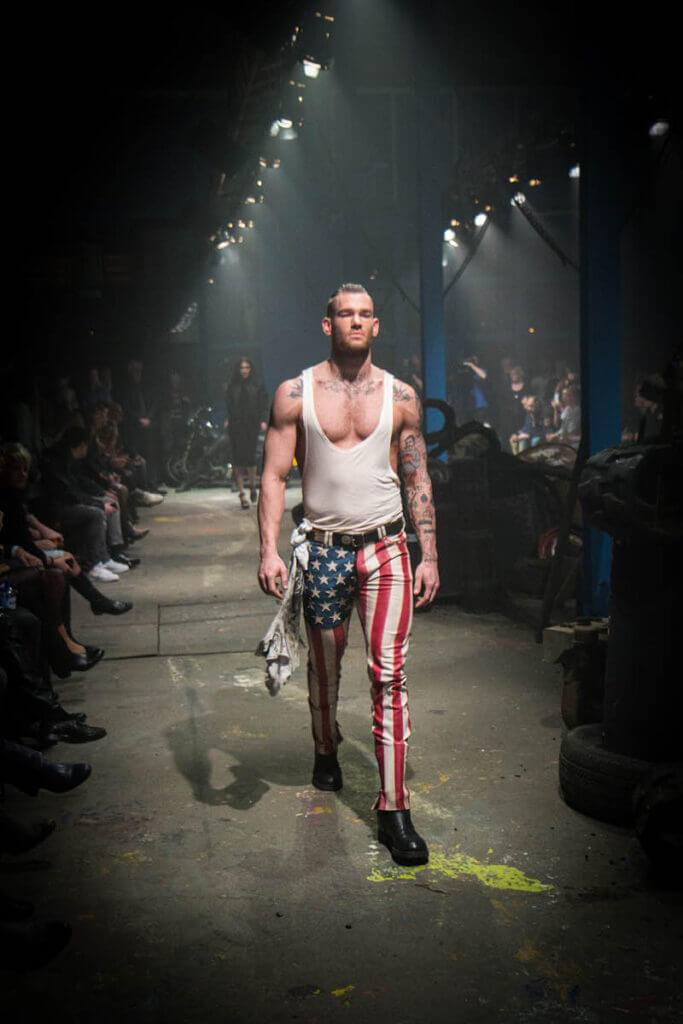 JANBOELO Fall Winter 2015 collection presentation at Paradigm Groningen, Model in leather trousers with american flag