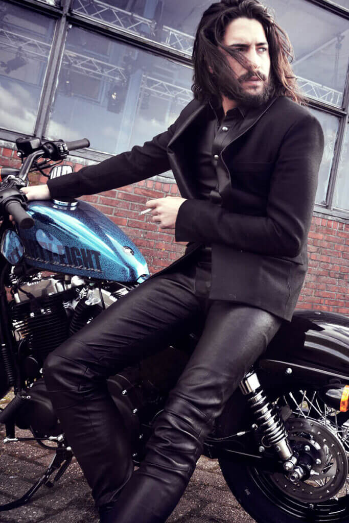 JANBOELO Fall Winter 2015 collection presentation at Paradigm Groningen, Model in leather suit on harley davidson motorcycle