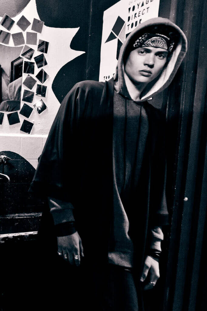 JANBOELO Fall Winter 2015 collection presentation at Paradigm Groningen, Model posing in grey hoodie with bandana