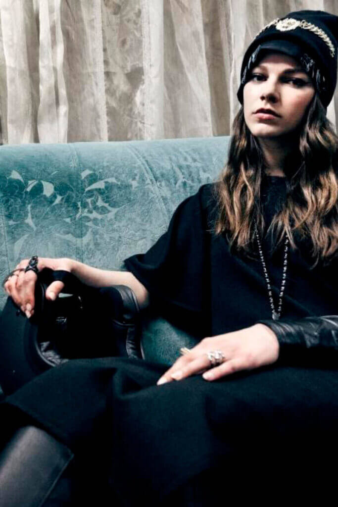 JANBOELO Fall Winter 2015 collection presentation at Paradigm Groningen, Model posing on green sofa