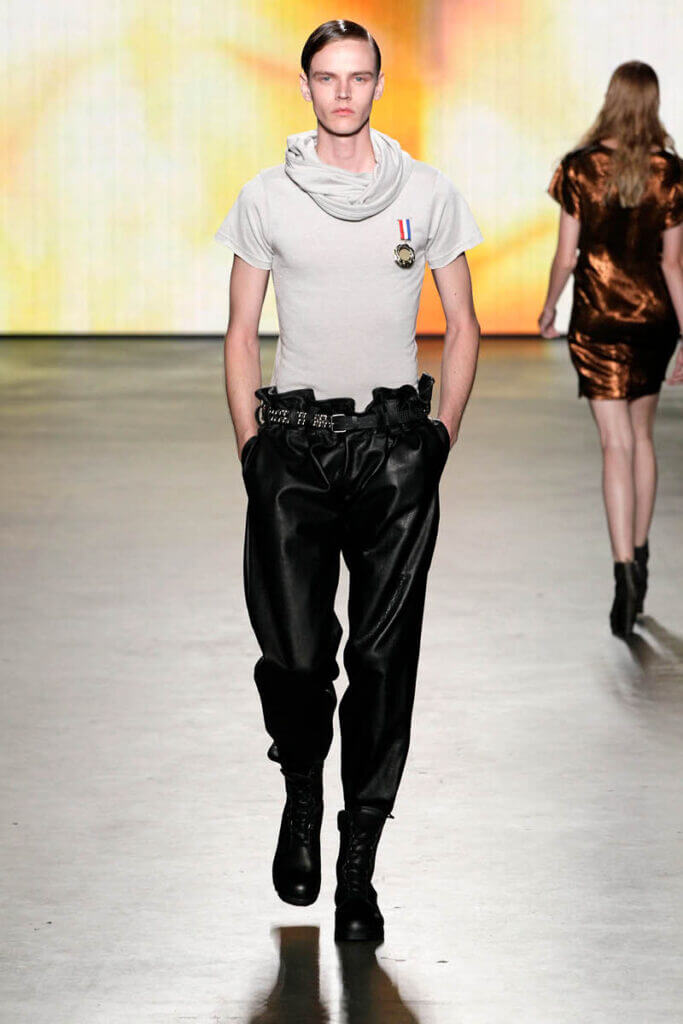 JANBOELO show Spring Summer 2013 collection Male model in stylish runway outfit with oversized leather trousers.