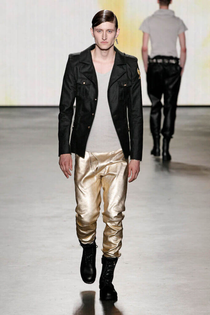 JANBOELO show Spring Summer 2013 collection Model in stylish black and gold outfit.