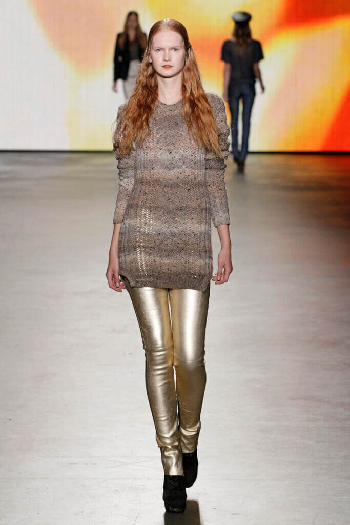 JANBOELO show Spring Summer 2013 collection Model in metallic trousers and sweater.