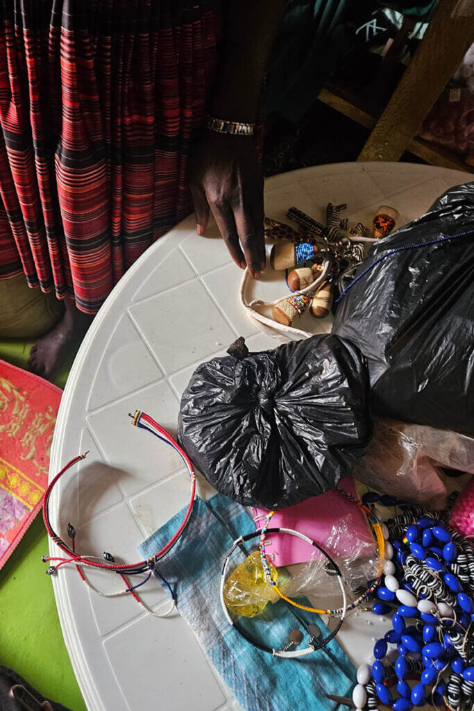 Gloria in Namalu Uganda is selling products made of beads as part of her daily life in Karamoja