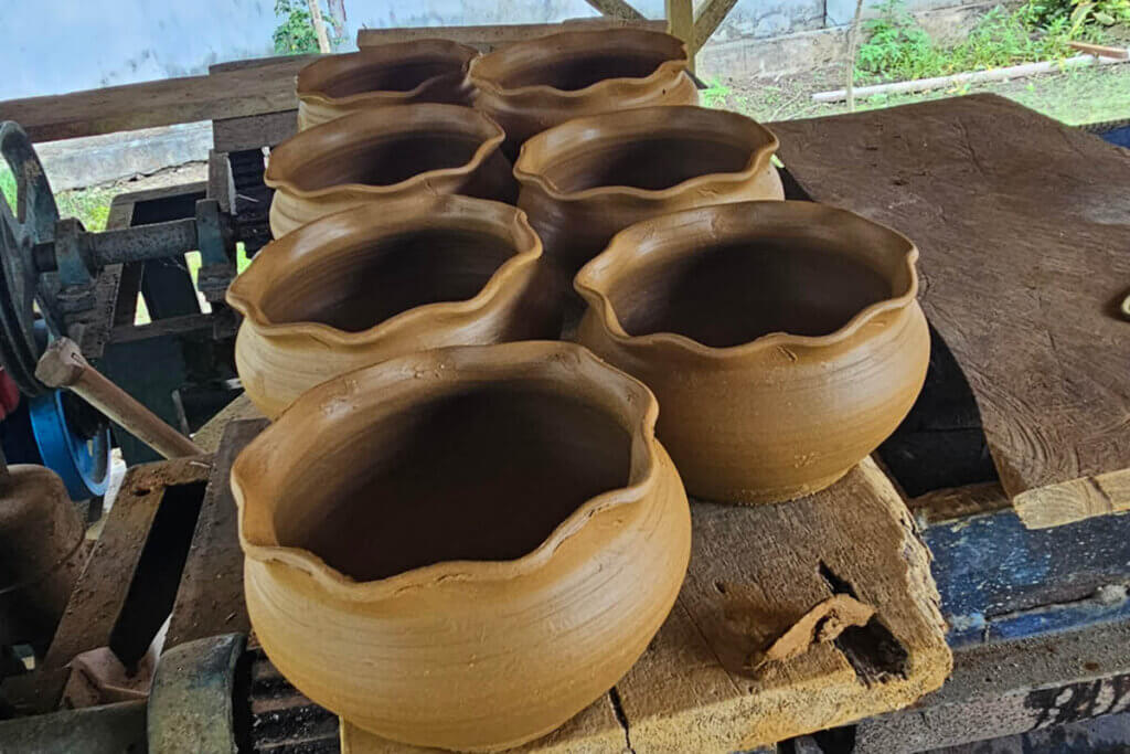 half ready pots that are just sculpted are ready to go into the oven in a pottery on Saparua Island in the Moluccas