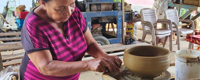 woman at the pottery workshop as part of making on Saparua Island in the Moluccas