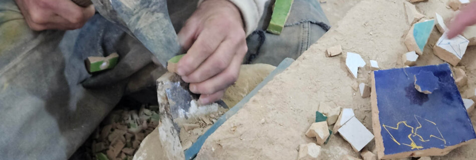 Craftsman working on handmade tiles in Fez Morocco