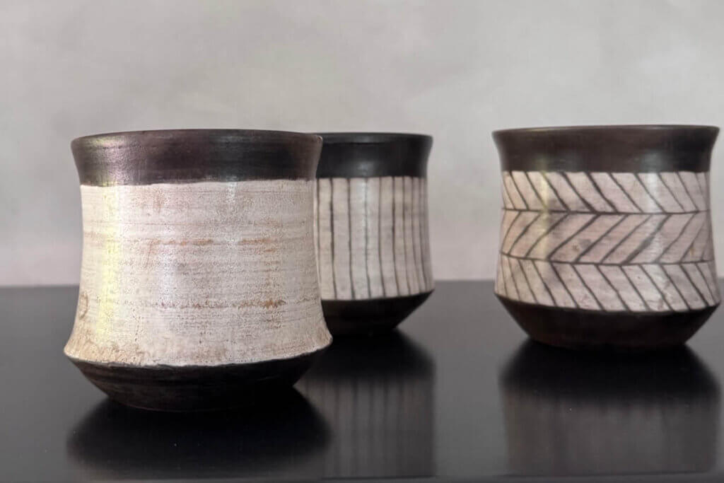 Handmade ceramic cups showing small imperfections