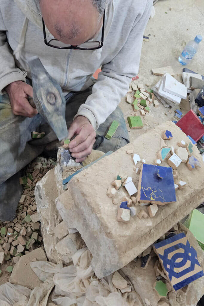 Local artisan creating handmade objects inside a workshop
